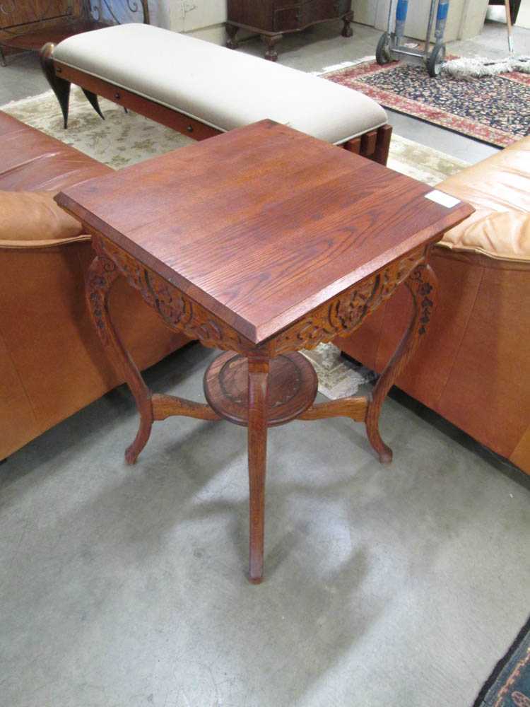 Appraisal: VICTORIAN LAMP TABLE the oak table having carved faces and