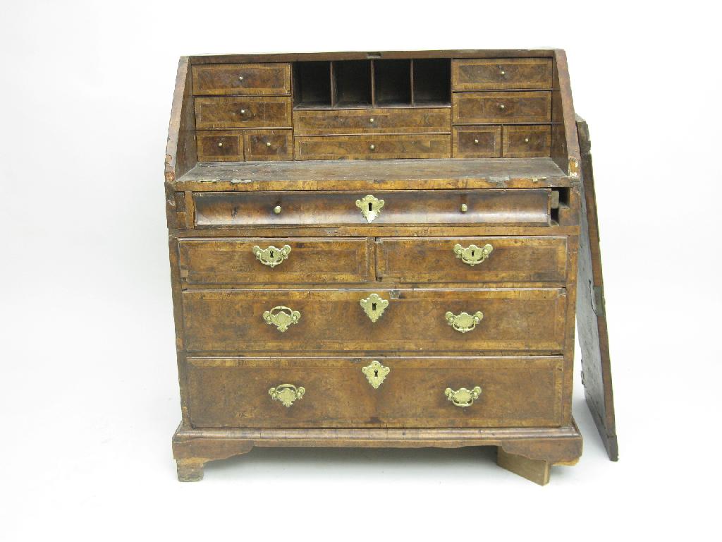 Appraisal: An early th Century walnut and oak Bureau enclosing fitted