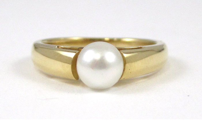 Appraisal: PEARL AND EIGHTEEN KARAT GOLD RING set with a mm