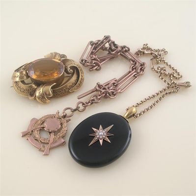 Appraisal: A Victorian gold brooch set with a citrine a black