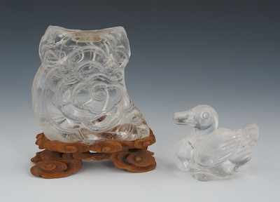 Appraisal: Two Chinese Carved Rock Crystal Decorations Lot includes a small