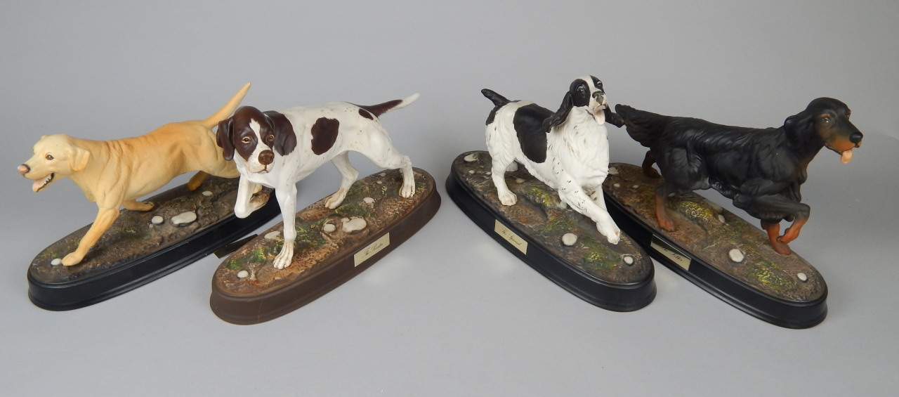 Appraisal: Four Royal Doulton and Beswick dog figures to include the