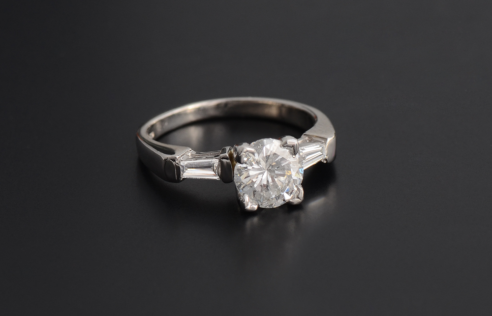 Appraisal: PLATINUM ENGAGEMENT RING Centering an approx Ct round brilliant diamond