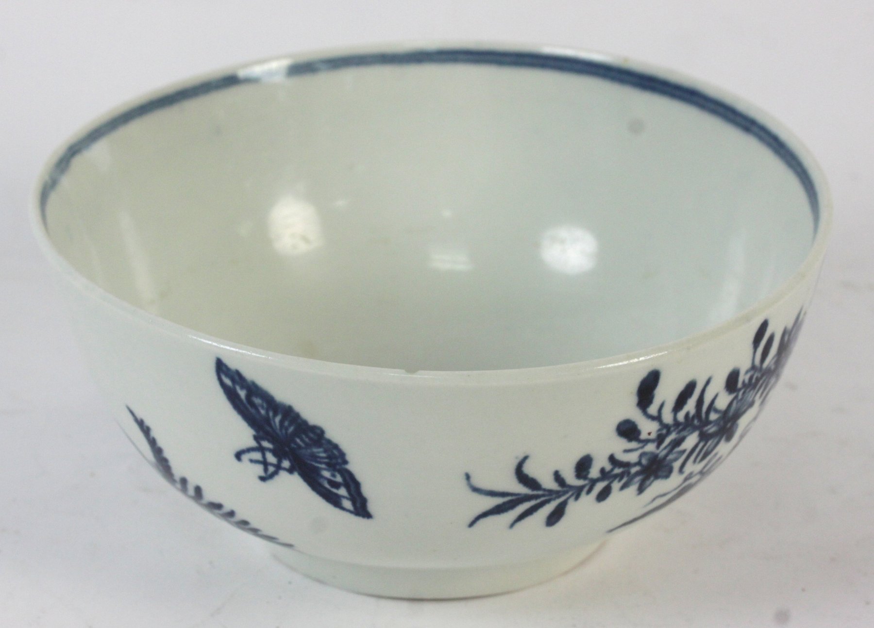 Appraisal: A Dr Wall blue and white bowl decorated butterflies and