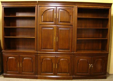 Appraisal: MODERN THREE-PART BOOKCASE the molded cornice over a central section