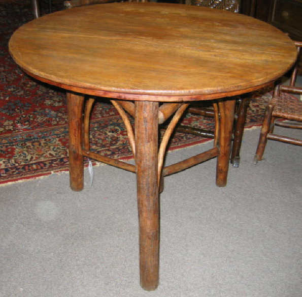 Appraisal: OLD HICKORY CIRCULAR TABLE Round oak top on three large