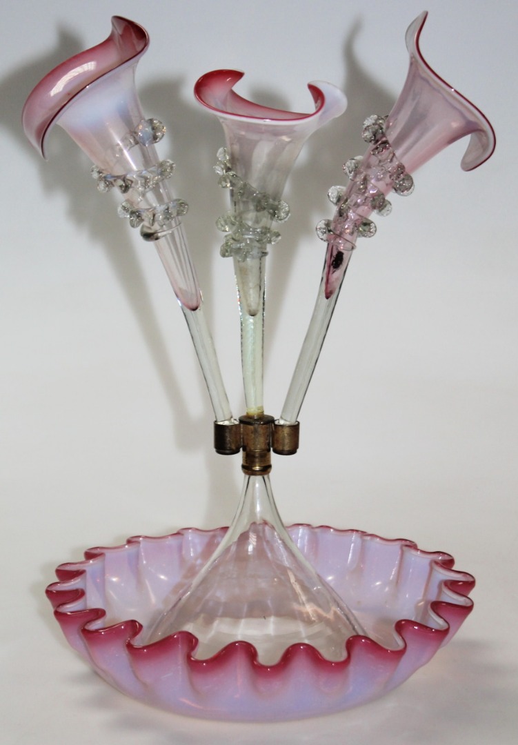 Appraisal: A late thC vaseline pink and clear glass epergne each