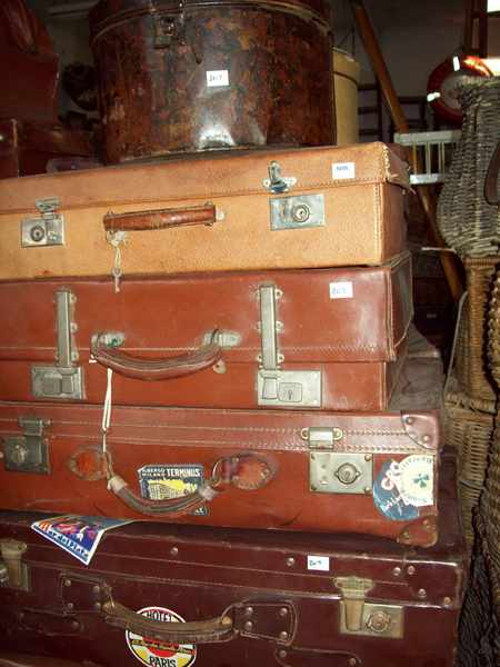 Appraisal: FIVE ANTIQUE LEATHER SUITCASES AND DOMED TIN HAT BOX