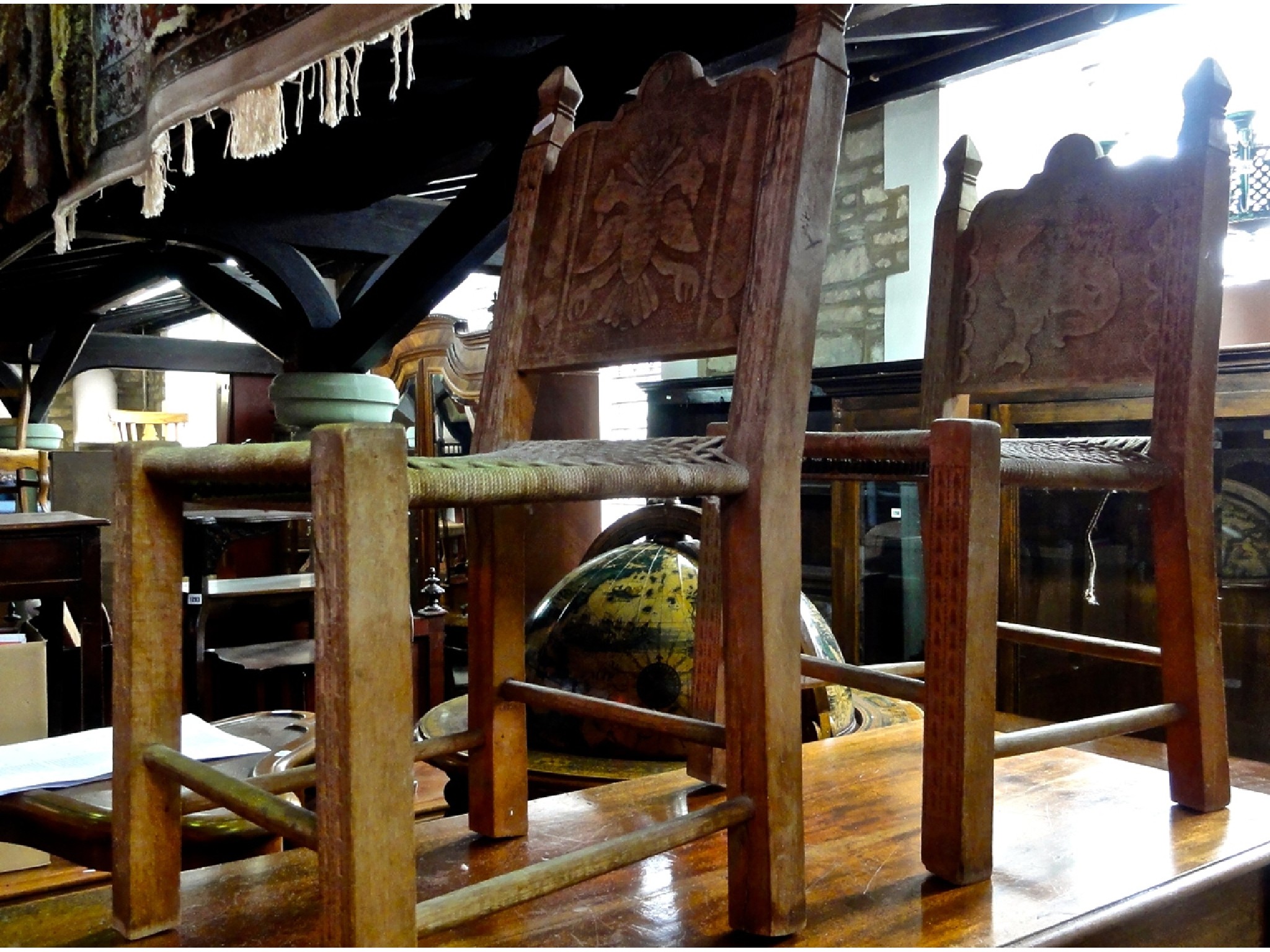 Appraisal: A pair of low eastern child's chairs the stripped wooden