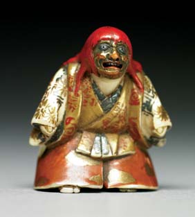 Appraisal: CARVED AND LACQUERED IVORY NETSUKE Carved and lacquered ivory netsuke