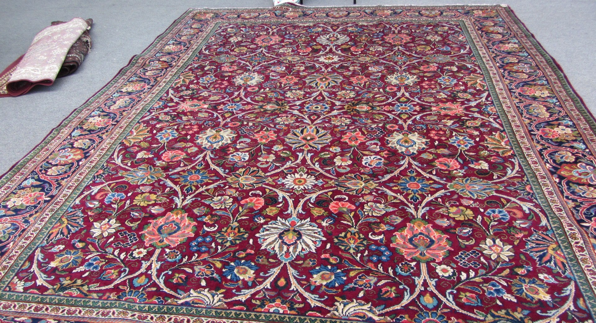 Appraisal: A Kashan carpet Persian the burgundy field with an allover