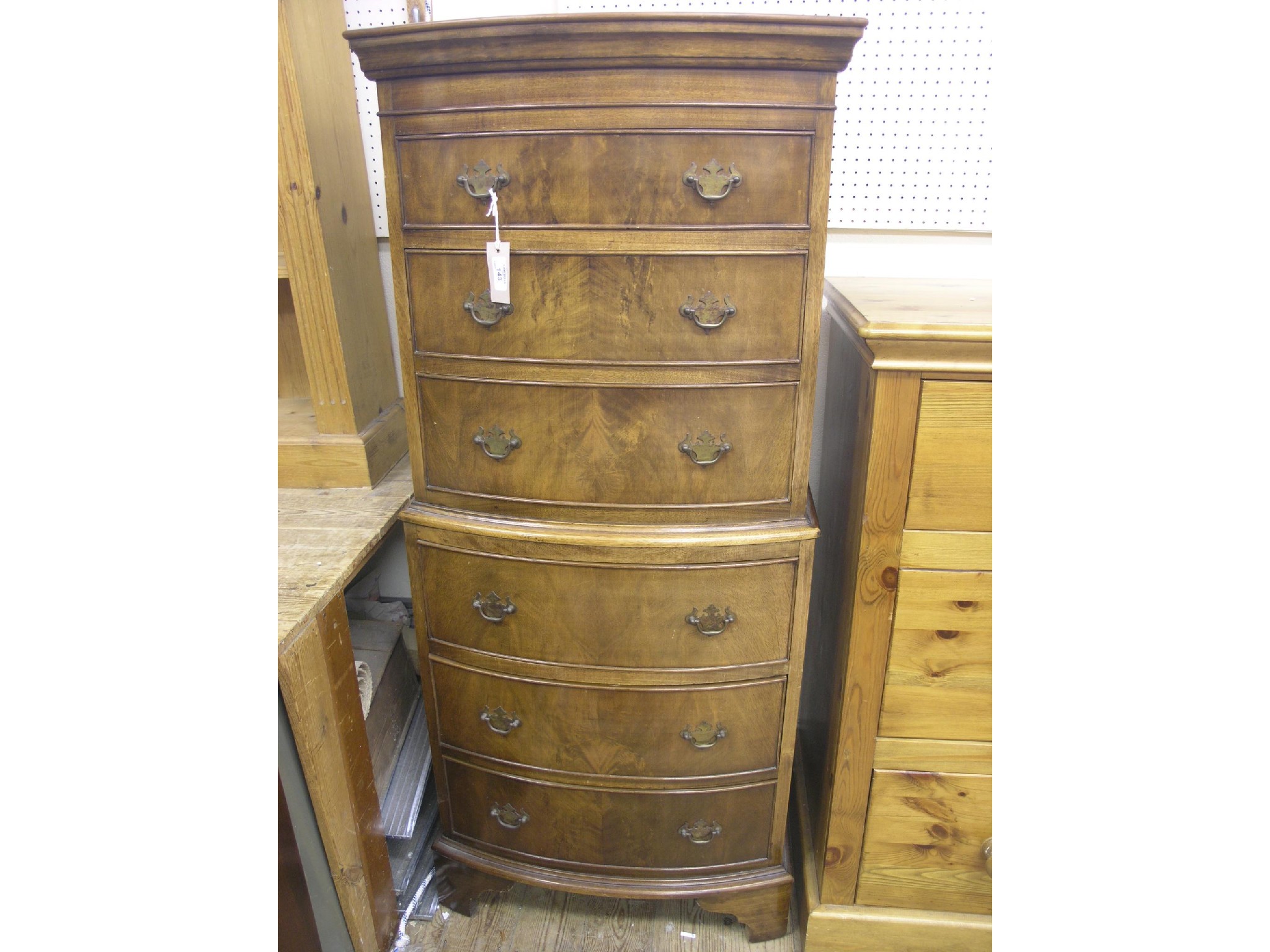 Appraisal: A walnut tallboy bow-fronted with six burr-veneered drawers ft in