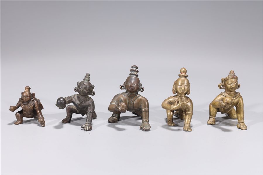 Appraisal: Group of five antique Indian crawling Krishna figures in bronze