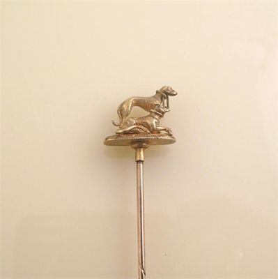 Appraisal: A well detailed gold stick pin depicting two grey hounds