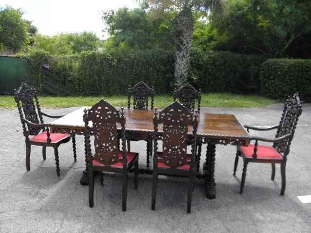 Appraisal: Ornately carved Walnut dining table and six chairs Spindle design