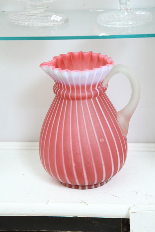 Appraisal: VICTORIAN ART GLASS PITCHER Opalescent cranberry and white stripe pattern