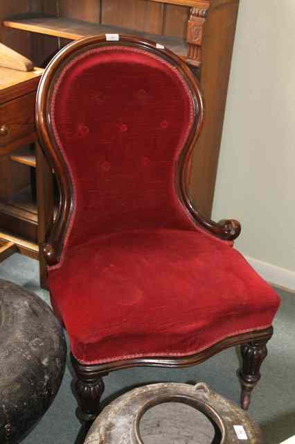 Appraisal: A VICTORIAN EASY CHAIR with spoon back shaped front and