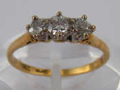 Appraisal: A yellow metal tests carat gold three stone diamond ring