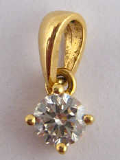 Appraisal: A yellow metal tests carat gold diamond solitaire pendant the