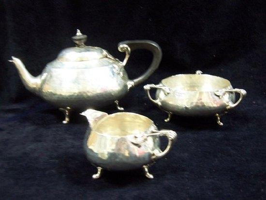 Appraisal: A three-piece tea set of Art Nouveau design with stylised