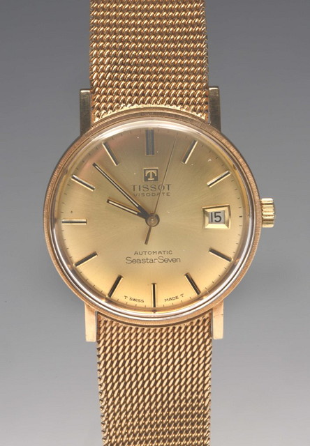 Appraisal: A CT GOLD TISSOT SEASTAR AUTOMATIC GENTLEMANS WRIST WATCH with