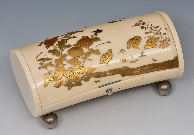 Appraisal: A Japanese ivory tusk section carved as a hinged box