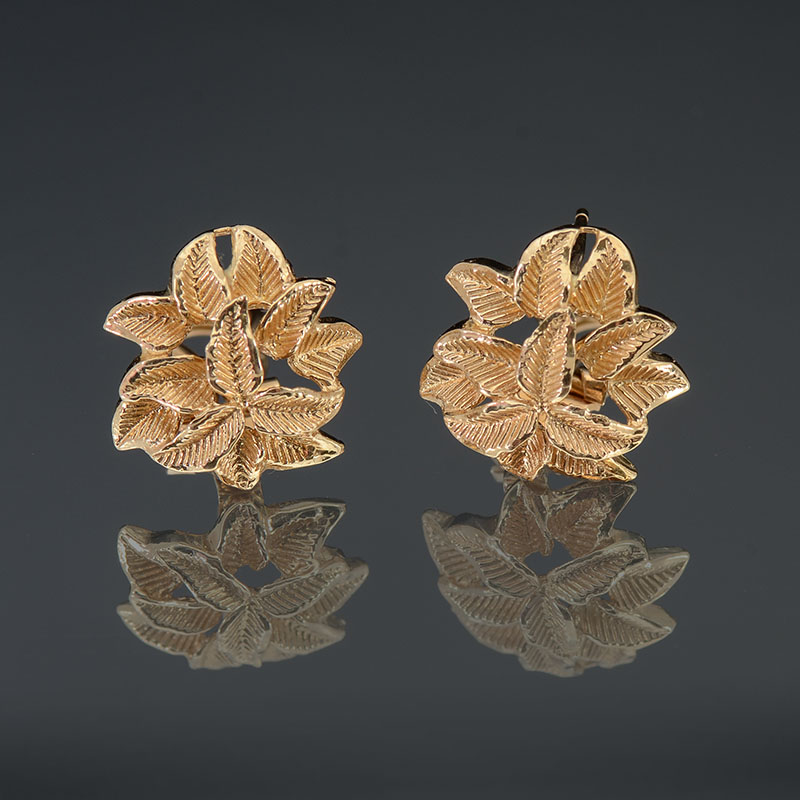 Appraisal: K LEAF MOTIF YELLOW GOLD EARCLIPS WITH POST Designed by