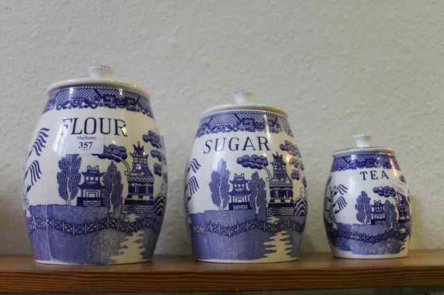 Appraisal: THREE STAFFORDSHIRE WILLOW PATTERN STORAGE JARS flour sugar and tea