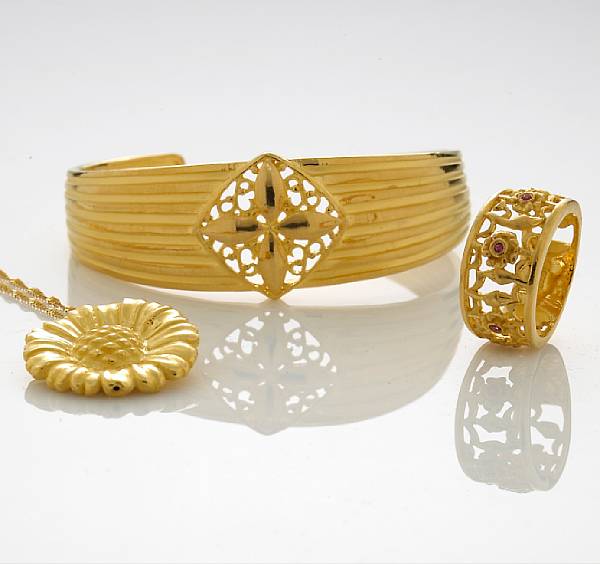 Appraisal: A collection of high karat gold jewelry comprising a cuff