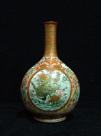 Appraisal: A Kutani bottle form vase painted with cartouche of birds