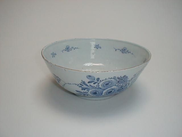 Appraisal: A Delft bowl painted in blue with simple flower forms