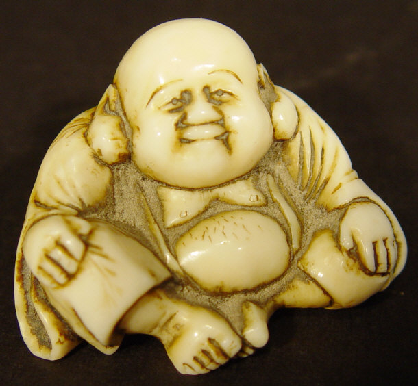 Appraisal: Oriental ivory netsuke carved as Buddha cm high