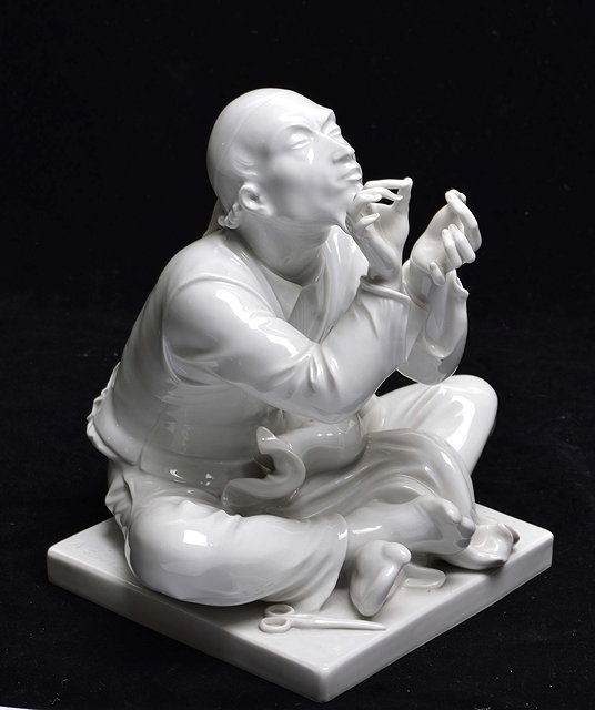 Appraisal: A WEIFS MEISSEN BLANC DE CHINE PORCELAIN FIGURE of Wibbel