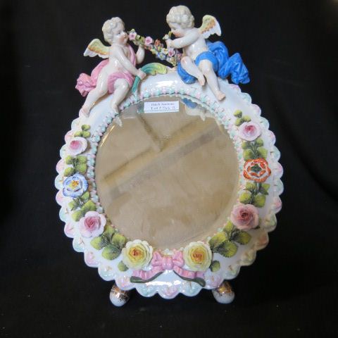 Appraisal: Royal Rudolstadt Porcelain Mirror figural cherubs garland at top applied