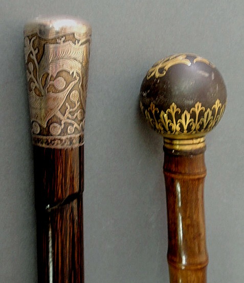 Appraisal: Two bamboo form walking sticks- one with gold inlaid metal