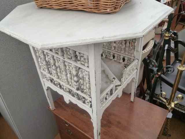 Appraisal: A WHITE PAINTED OCTAGONAL MOORISH STYLE OCCASIONAL TABLE standing on