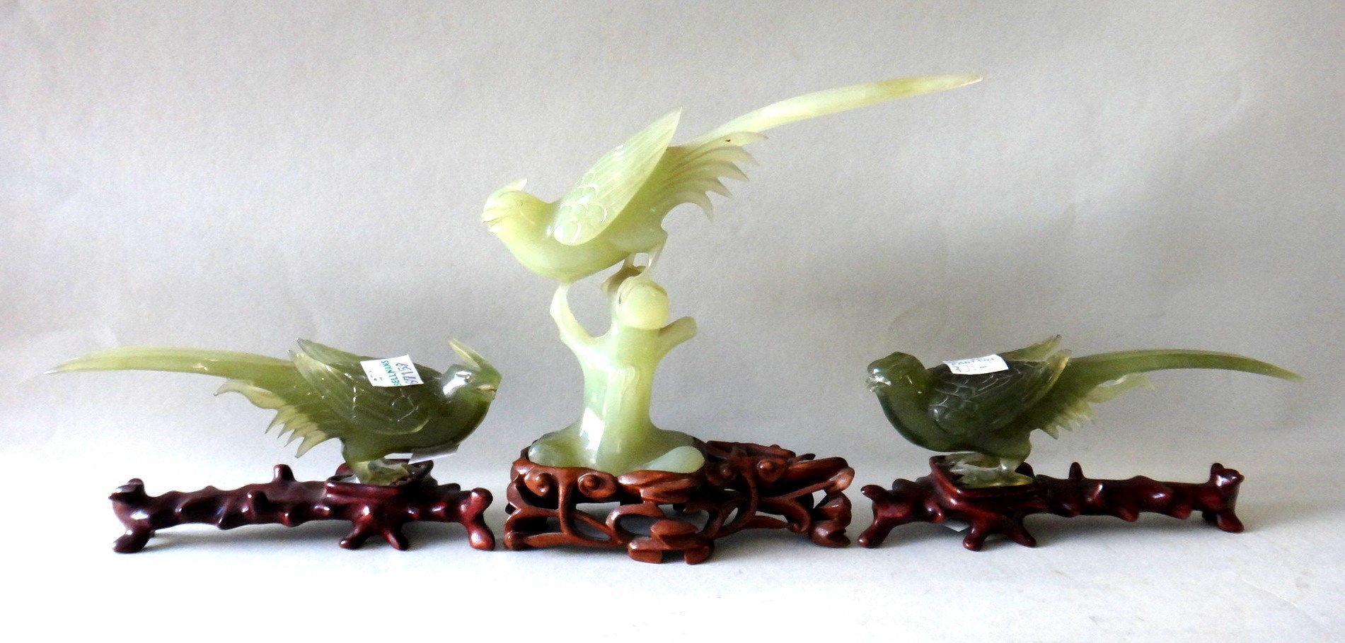 Appraisal: Three Chinese green hardstone figures of birds th century the