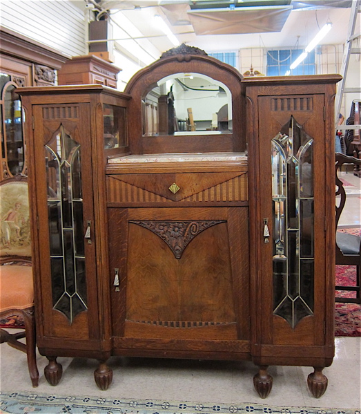 Appraisal: SMALL CARVED OAK AND LEADED GLASS SIDEBOARD Belgian early th