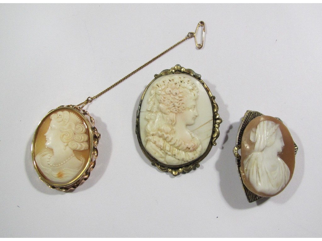 Appraisal: Lot comprising three cameo brooches one with unmarked gold mount