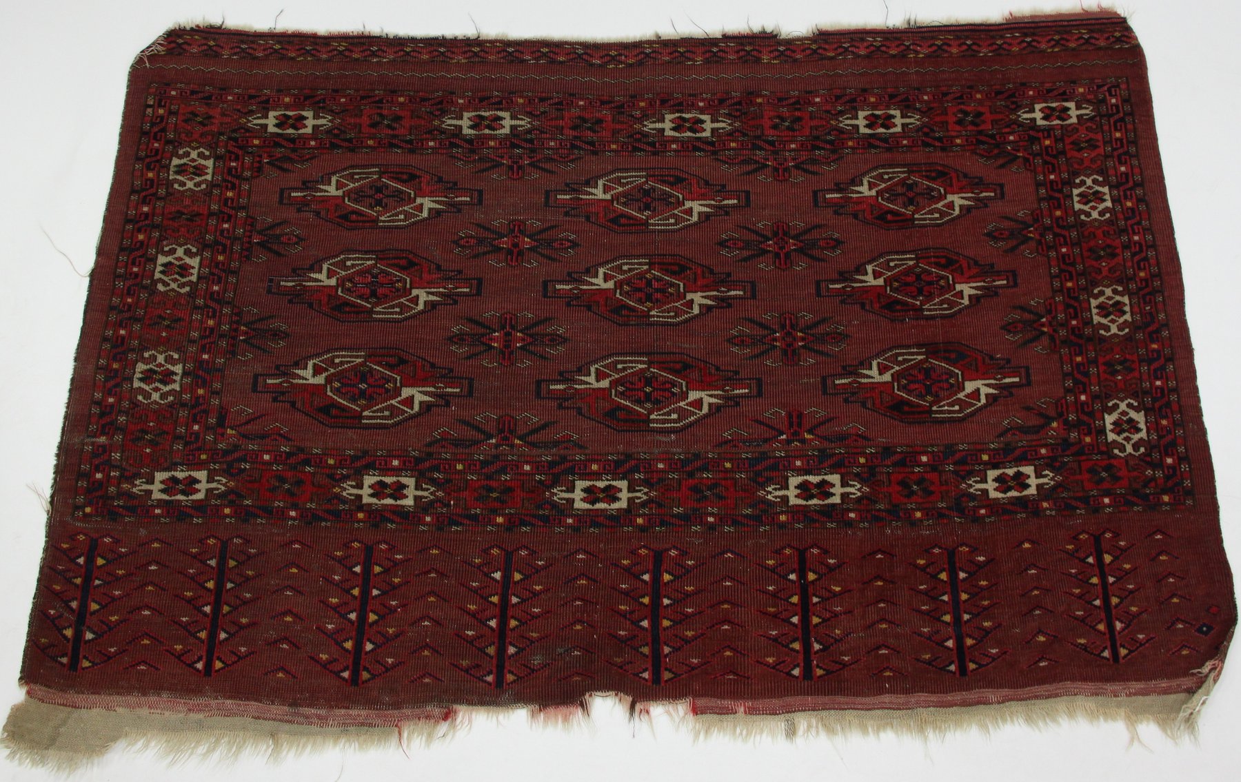 Appraisal: A Boukarah rug with three rows of three elephant foot