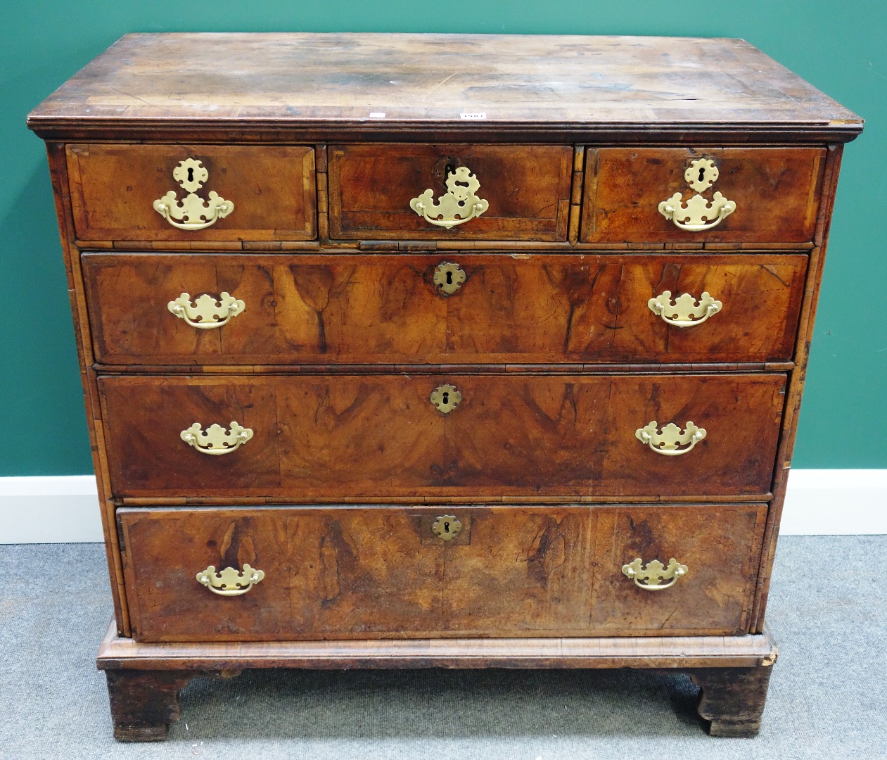 Appraisal: A George I walnut chest of three short and three