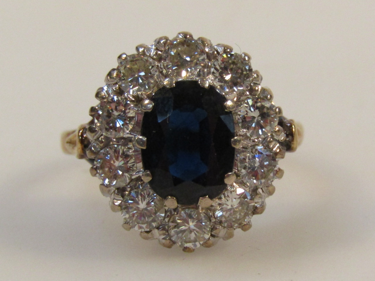 Appraisal: A ladies eleven stone sapphire and diamond cluster ring with