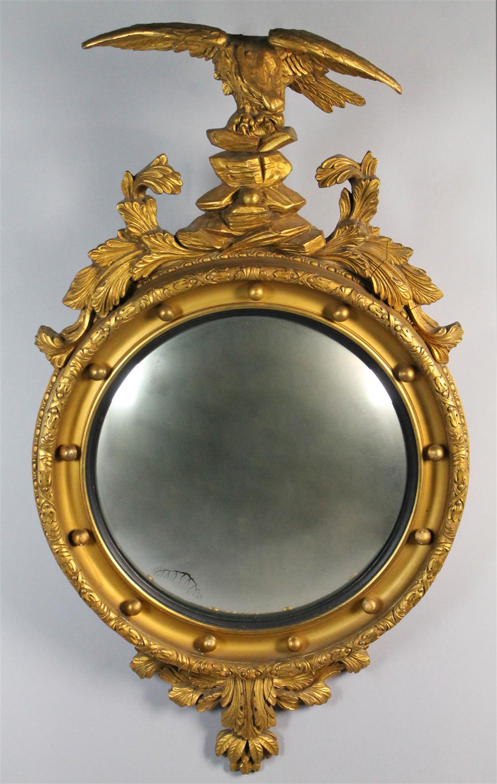 Appraisal: CLASSICAL STYLE GILTWOOD CONVEX MIRROR WITH EAGLE having a large