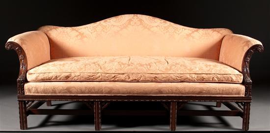 Appraisal: Chinese Chippendale style carved mahogany upholstered camel-back sofa Potthast Brothers