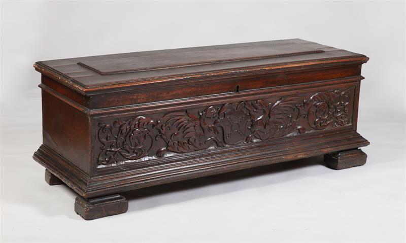 Appraisal: ITALIAN BAROQUE CARVED WALNUT CASSONE The hinged top with raised