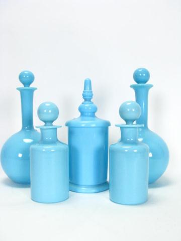 Appraisal: Collection of opaque blue stoppered bottles including two pair and