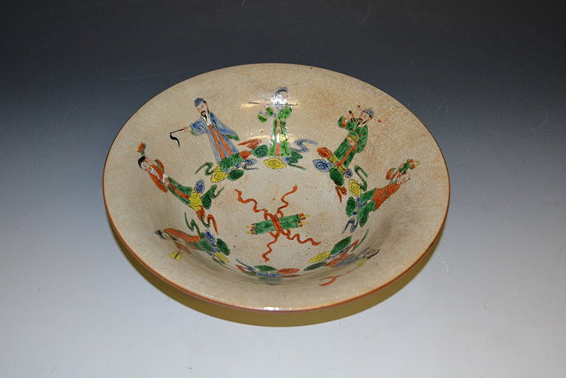 Appraisal: A Chinese crackleware bowl th Centurydecorated with musicians to the