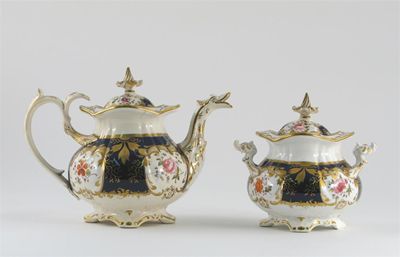 Appraisal: A porcelain part tea service painted with panels on flowers