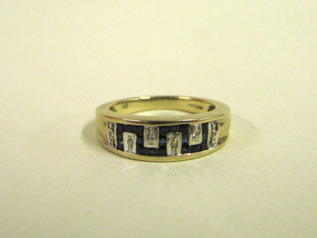 Appraisal: Nine carat gold diamond and step cut sapphire Greek key