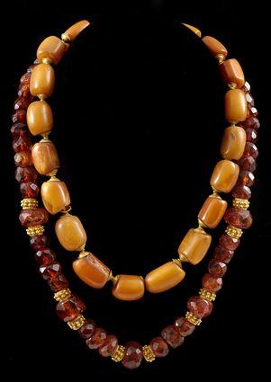 Appraisal: Two Amber Necklaces with Gold Spacers